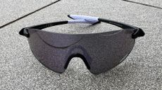 The Tifosi Vogel XC Sunglasses on a grey tile